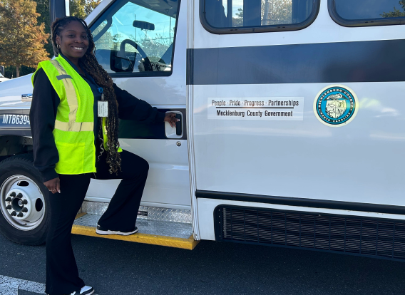 MTS driver An MTS bus driver standing near the driver's side of the bus.